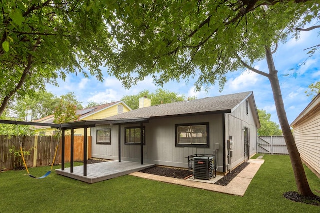 3050 Beacon Fld, San Antonio, TX 78245 - rear view of property featuring a wooden deck, a fenced backyard, a shingled roof, and a chimney
