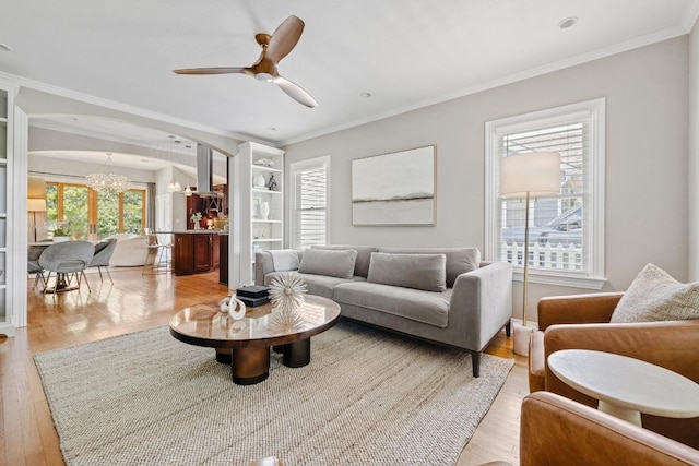 4206 Sinclair Ave, Austin, TX 78756 - living area featuring a chandelier, wood finished floors, ornamental molding, and ceiling fan