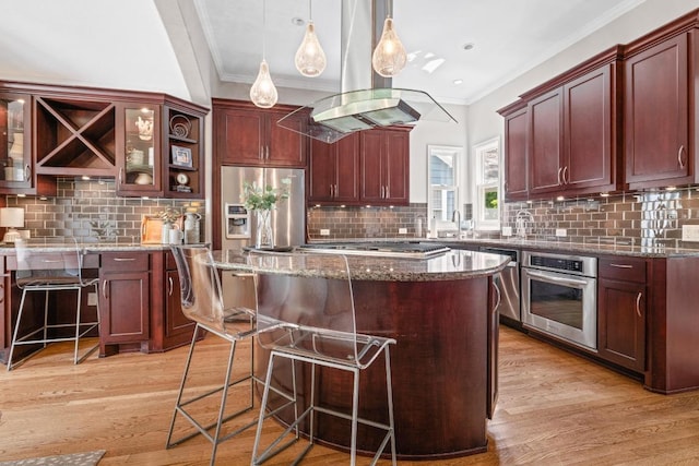 4206 Sinclair Ave, Austin, TX 78756 - kitchen with stainless steel appliances, crown molding, light wood-style floors, backsplash, and a breakfast bar area
