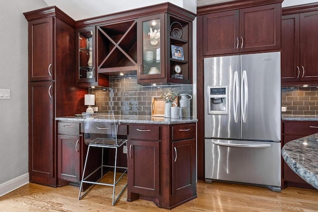 4206 Sinclair Ave, Austin, TX 78756 - bar area featuring stainless steel fridge with ice dispenser, light wood finished floors, and decorative backsplash