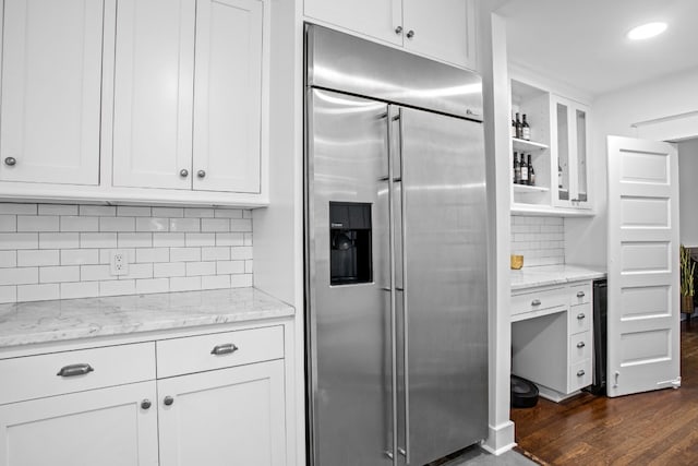 607 W 32nd St, Austin, TX 78705 - kitchen featuring stainless steel built in refrigerator, white cabinetry, backsplash, dark wood-style floors, and glass insert cabinets