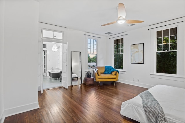 607 W 32nd St, Austin, TX 78705 - bedroom with multiple windows, wood finished floors, and a ceiling fan