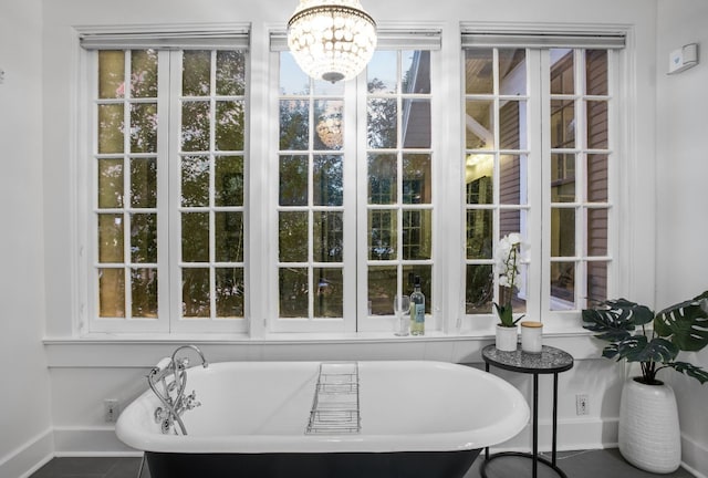 607 W 32nd St, Austin, TX 78705 - full bath featuring baseboards and a freestanding tub