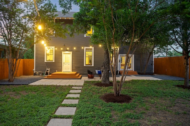 607 W 32nd St, Austin, TX 78705 - view of front of house featuring a fenced backyard, entry steps, and a patio