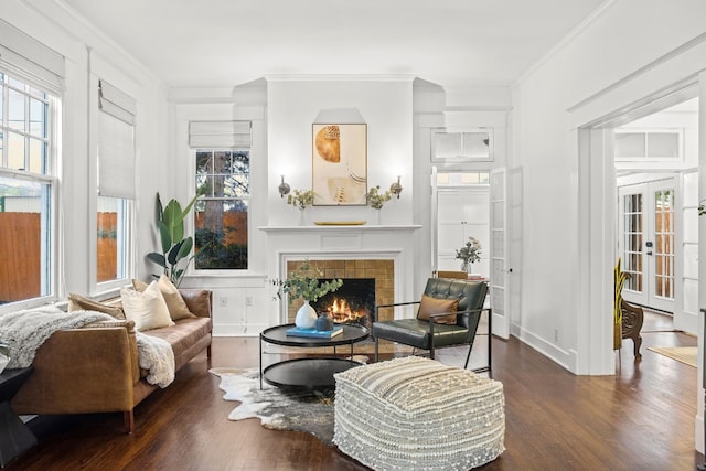 607 W 32nd St, Austin, TX 78705 - living area with plenty of natural light, wood finished floors, ornamental molding, and a tile fireplace
