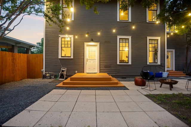 607 W 32nd St, Austin, TX 78705 - back of property at dusk with a patio area