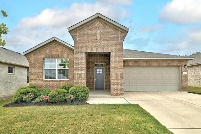 9108 Alex Ln, Austin, TX 78748 - view of front facade featuring brick siding, a garage, driveway, and a front yard