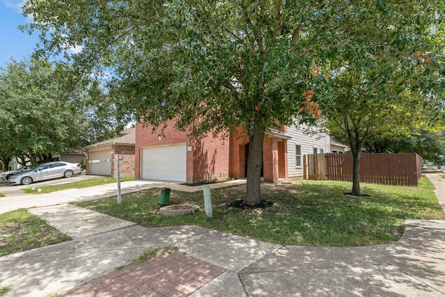 6828 Walkup Ln, Austin, TX 78747 - view of property hidden behind natural elements featuring driveway, brick siding, and a garage