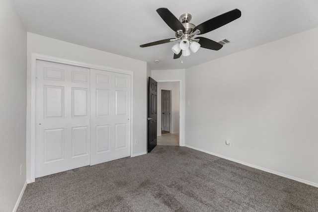 6828 Walkup Ln, Austin, TX 78747 - unfurnished bedroom featuring carpet floors, a closet, and a ceiling fan