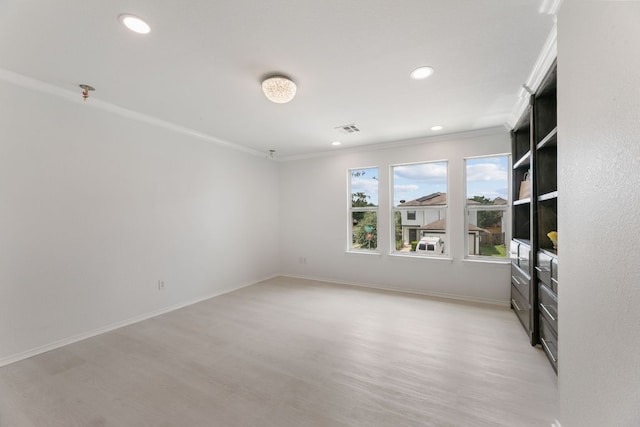 6828 Walkup Ln, Austin, TX 78747 - unfurnished room featuring light wood finished floors, ornamental molding, and recessed lighting