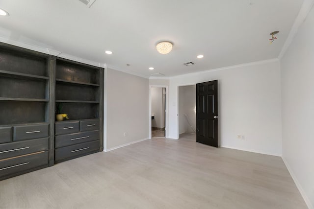 6828 Walkup Ln, Austin, TX 78747 - unfurnished bedroom featuring crown molding, light wood-type flooring, and recessed lighting