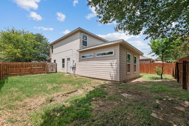 6828 Walkup Ln, Austin, TX 78747 - rear view of house with a fenced backyard