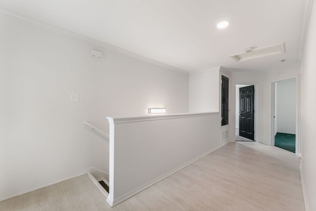 6828 Walkup Ln, Austin, TX 78747 - hall with wood finished floors, attic access, an upstairs landing, ornamental molding, and recessed lighting
