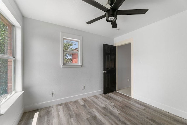6828 Walkup Ln, Austin, TX 78747 - spare room featuring wood finished floors and a ceiling fan