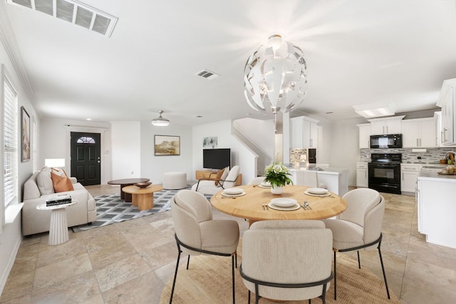 6828 Walkup Ln, Austin, TX 78747 - dining space featuring a chandelier and light stone finish flooring