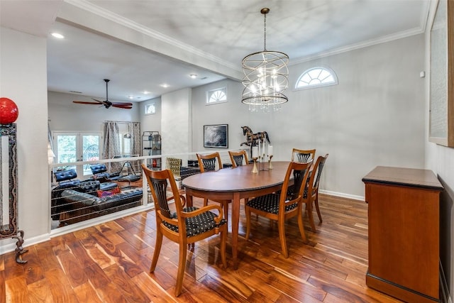 5731 Sam Houston Cir, Austin, TX 78731 - dining area featuring wood finished floors, crown molding, a ceiling fan, recessed lighting, and a chandelier