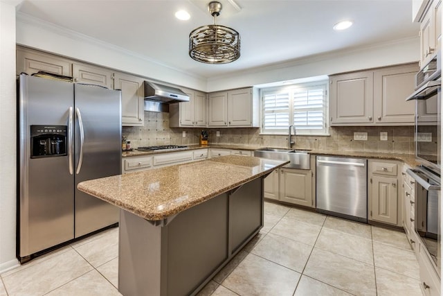 5731 Sam Houston Cir, Austin, TX 78731 - kitchen featuring appliances with stainless steel finishes, range hood, a kitchen island, light stone countertops, and crown molding