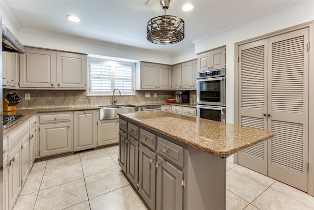 5731 Sam Houston Cir, Austin, TX 78731 - kitchen with stainless steel appliances, gray cabinetry, decorative backsplash, light tile patterned floors, and ornamental molding