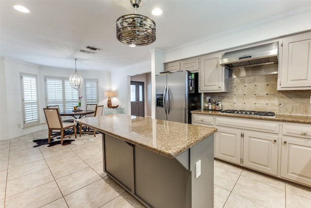 5731 Sam Houston Cir, Austin, TX 78731 - kitchen featuring stainless steel appliances, a chandelier, light stone countertops, backsplash, and recessed lighting