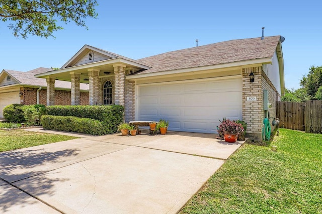 803 Hank Aaron Ln, Round Rock, TX 78665 - view of front of property with driveway, brick siding, a garage, and roof with shingles