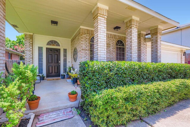 803 Hank Aaron Ln, Round Rock, TX 78665 - doorway to property with brick siding and covered porch