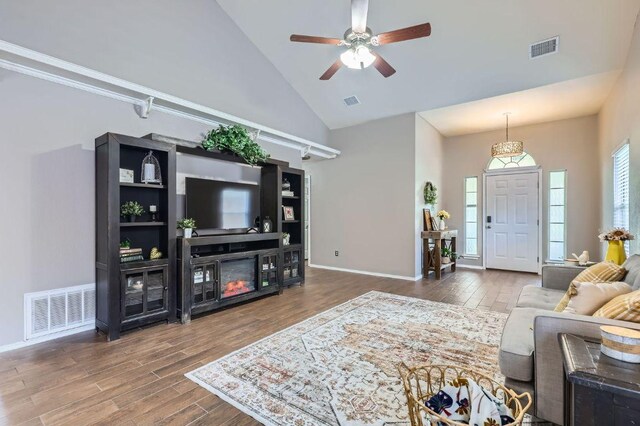 803 Hank Aaron Ln, Round Rock, TX 78665 - living area with high vaulted ceiling, wood finished floors, and a ceiling fan