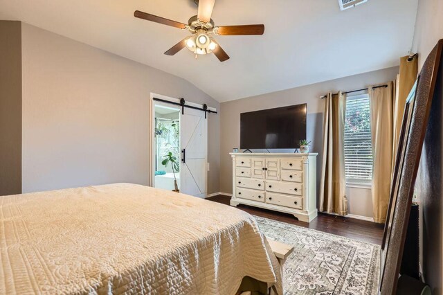 803 Hank Aaron Ln, Round Rock, TX 78665 - bedroom with vaulted ceiling, a barn door, dark wood-type flooring, and ceiling fan