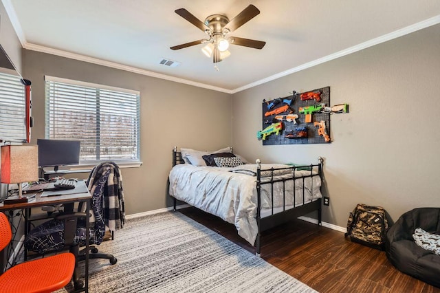 803 Hank Aaron Ln, Round Rock, TX 78665 - bedroom with an office area, crown molding, wood finished floors, and a ceiling fan