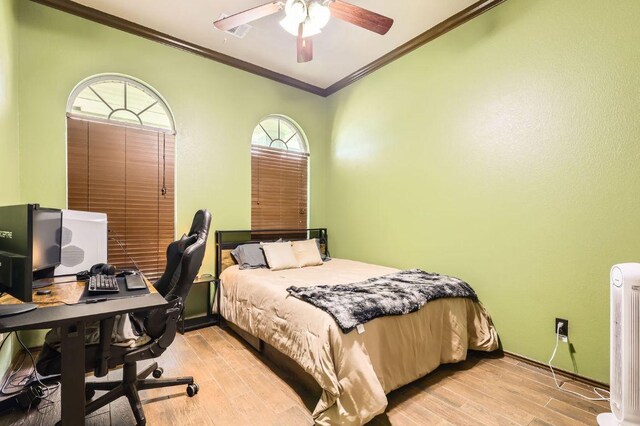 803 Hank Aaron Ln, Round Rock, TX 78665 - bedroom with ornamental molding, light wood-type flooring, an office area, radiator heating unit, and ceiling fan