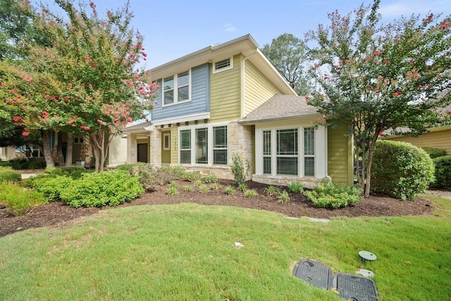 11013 Avery Station Loop Unit 31, Austin, TX 78717 - view of front of property with stone siding and a front yard