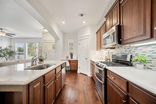 11013 Avery Station Loop Unit 31, Austin, TX 78717 - kitchen with stainless steel appliances, tasteful backsplash, light countertops, and recessed lighting