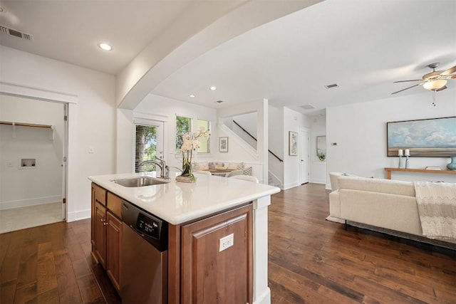 11013 Avery Station Loop Unit 31, Austin, TX 78717 - kitchen with stainless steel dishwasher, open floor plan, dark wood finished floors, light countertops, and recessed lighting