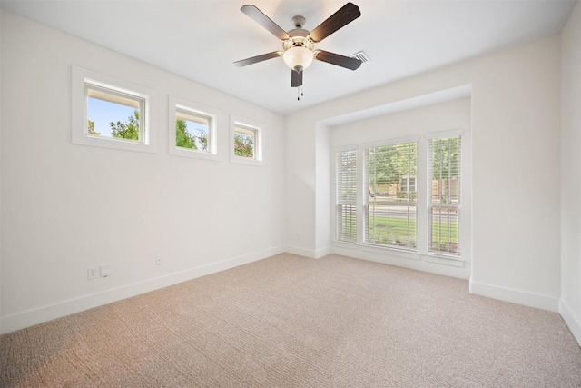 11013 Avery Station Loop Unit 31, Austin, TX 78717 - carpeted empty room featuring healthy amount of natural light and a ceiling fan