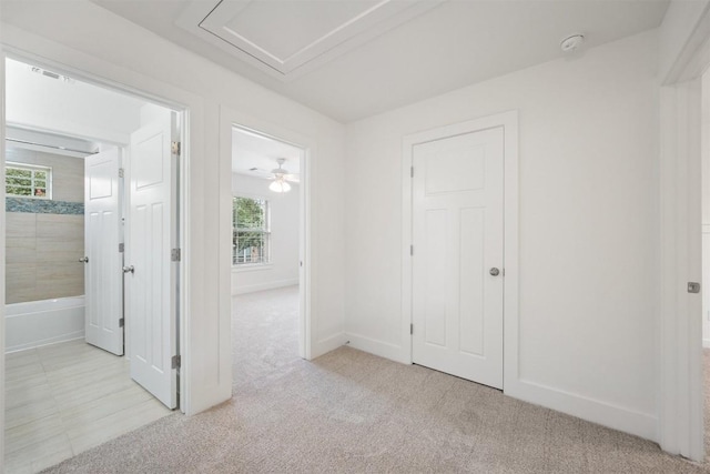 11013 Avery Station Loop Unit 31, Austin, TX 78717 - unfurnished bedroom featuring light carpet and baseboards