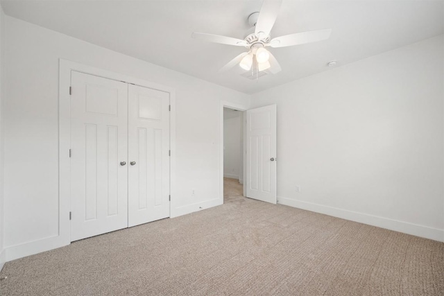 11013 Avery Station Loop Unit 31, Austin, TX 78717 - unfurnished bedroom featuring light carpet, a closet, and a ceiling fan