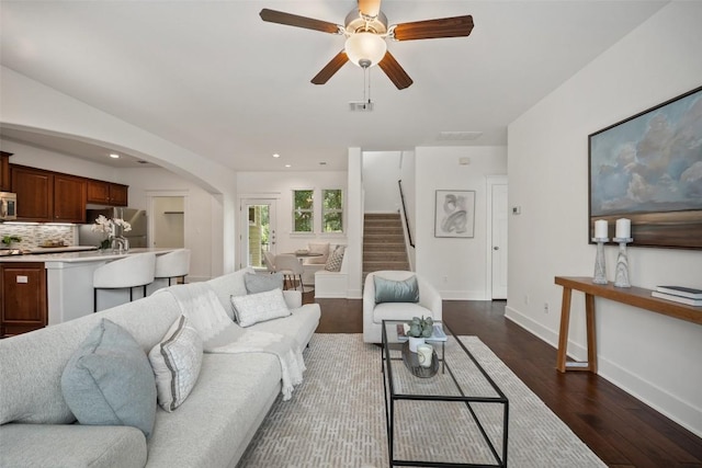 11013 Avery Station Loop Unit 31, Austin, TX 78717 - living room with stairs, arched walkways, dark wood-style flooring, ceiling fan, and recessed lighting