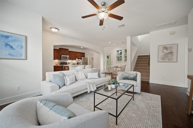 11013 Avery Station Loop Unit 31, Austin, TX 78717 - living room featuring arched walkways, dark wood-type flooring, ceiling fan, stairway, and recessed lighting