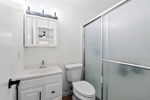 8104 Bronco Ln, Lago Vista, TX 78645 - full bathroom featuring vanity, a shower with shower door, and a ceiling fan