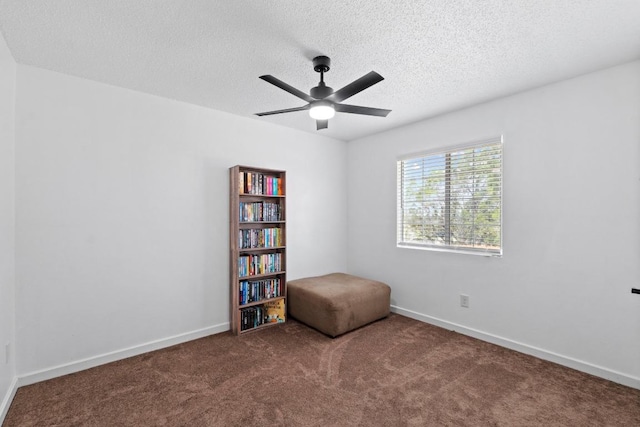 8104 Bronco Ln, Lago Vista, TX 78645 - unfurnished room with carpet flooring, a textured ceiling, and ceiling fan