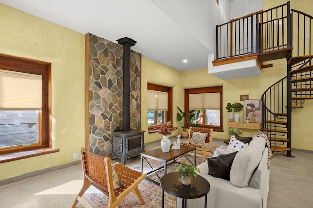 913 Taulbee Ln, Austin, TX 78757 - living room featuring a wood stove and stairs