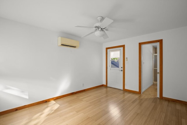 913 Taulbee Ln, Austin, TX 78757 - unfurnished room with an AC wall unit, light wood-style flooring, and ceiling fan