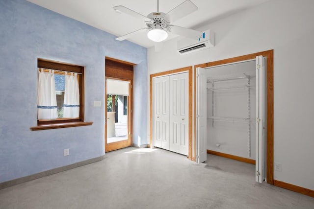 913 Taulbee Ln, Austin, TX 78757 - unfurnished bedroom featuring a wall mounted air conditioner, two closets, and a ceiling fan