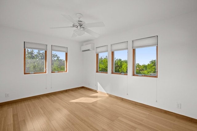 913 Taulbee Ln, Austin, TX 78757 - unfurnished room with a wall mounted AC, light wood-type flooring, and ceiling fan
