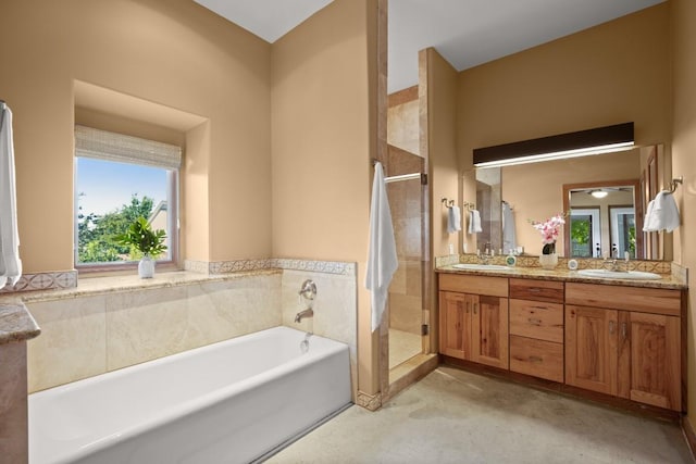 913 Taulbee Ln, Austin, TX 78757 - bathroom with double vanity, a stall shower, and a bath