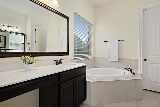 1113 Hartman Dr, Leander, TX 78641 - bathroom with a garden tub, vanity, and tile patterned floors