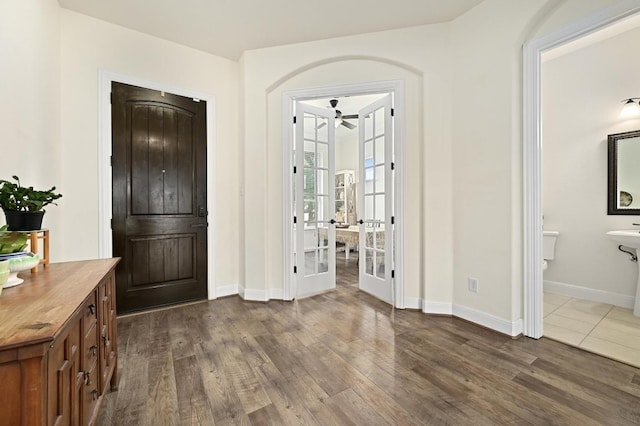 1113 Hartman Dr, Leander, TX 78641 - foyer featuring dark wood-style flooring, ceiling fan, and french doors