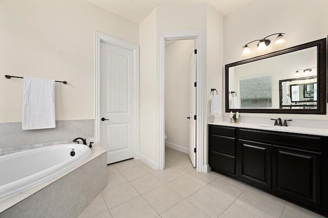 1113 Hartman Dr, Leander, TX 78641 - bathroom with vanity, a garden tub, and tile patterned flooring