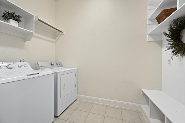 1113 Hartman Dr, Leander, TX 78641 - laundry area with washer and clothes dryer and light tile patterned floors