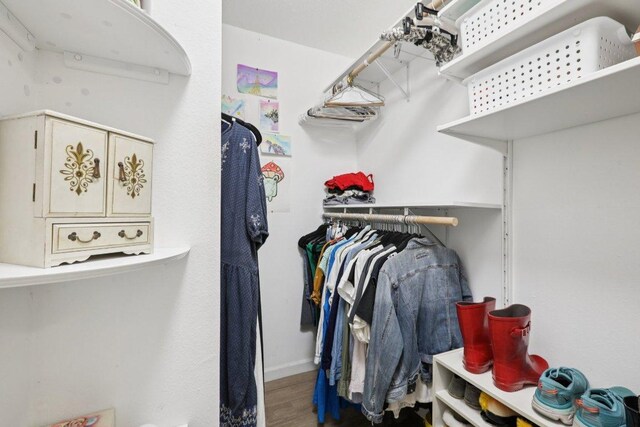 6803 Moonmont Dr, Austin, TX 78745 - spacious closet featuring wood finished floors