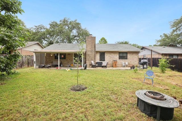 6803 Moonmont Dr, Austin, TX 78745 - back of property with a fire pit, a fenced backyard, a chimney, and a patio area
